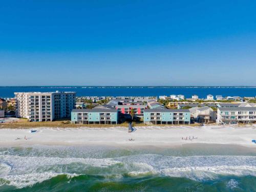 an aerial view of a beach with buildings and the ocean at Villas on the Gulf #E7 - Flip Flop Inn in Pensacola Beach
