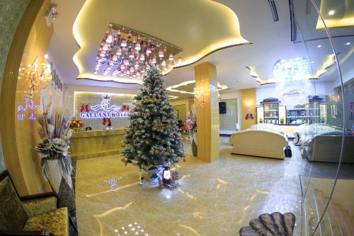 a christmas tree in the lobby of a store at Gallant Hotel 168 in Hai Phong