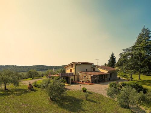 a house in the middle of a field at Tenuta il Poggetto in Radda in Chianti