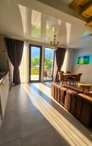 a living room with a couch and a table at Luxury Cottage Resort in Patara-Tsemi