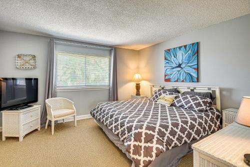 a bedroom with a bed and a flat screen tv at Boat Dock, Slips & Pool! St Johns River Condo in Welaka