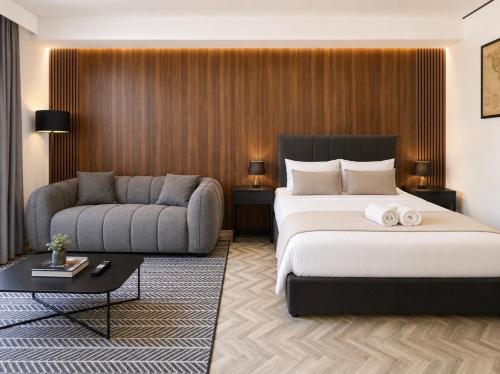 a hotel room with a bed and a couch at City Centre Oasis in Cape Town