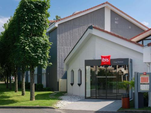 a bus stop in front of a building at ibis Cergy Pontoise Le Port in Cergy