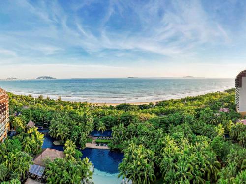 an aerial view of a resort with a beach at Pullman Oceanview Sanya Bay Resort & Spa in Sanya
