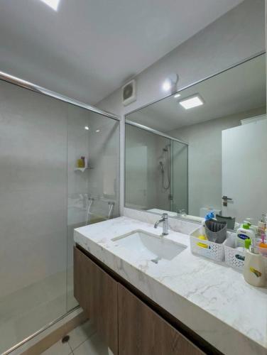 a bathroom with a sink and a mirror at David House 3BR Pent Mira in Lima