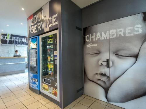 a store with a cash machine in a mall at ibis budget Vienne Sud in Vienne