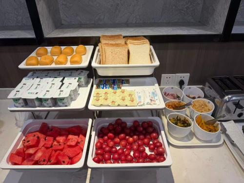 an open refrigerator filled with different types of food at Hanting Hotel Shanghai Wujiaochang in Shanghai