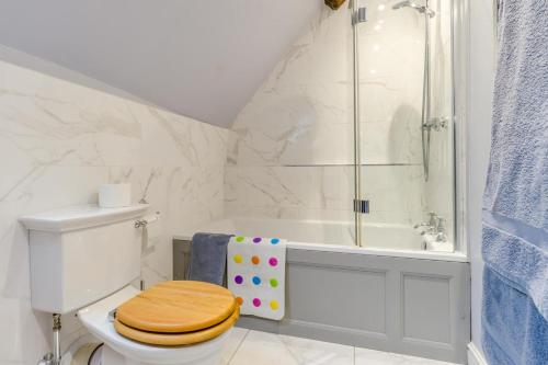 a white bathroom with a toilet and a shower at 2 Bed in Ludlow oc-78885 in Ludlow