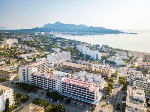 an aerial view of a city with the water at INNSiDE by Meliá Alcudia in Port d'Alcudia