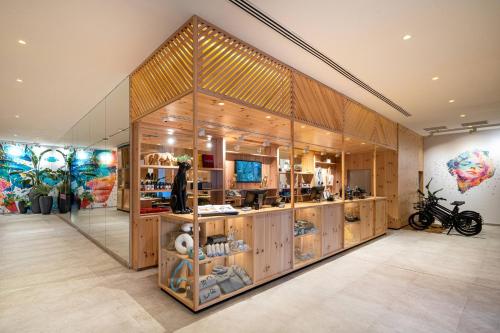 a shop with wooden walls and a large display case at INNSiDE by Meliá Calviá Beach in Magaluf