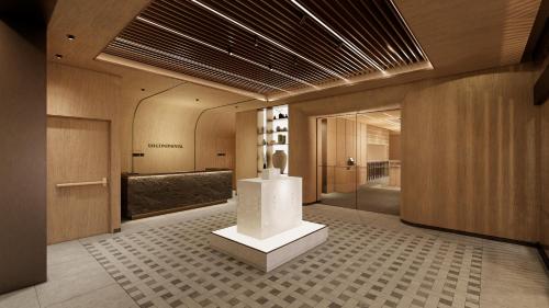 a lobby with a sculpture in the middle of a building at UH Continental SeoulCenter in Seoul