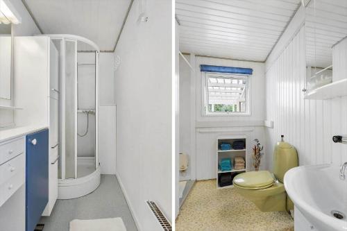 a white bathroom with a toilet and a sink at FJ2401-Skibby-Gogevaenget-31 in Skibby