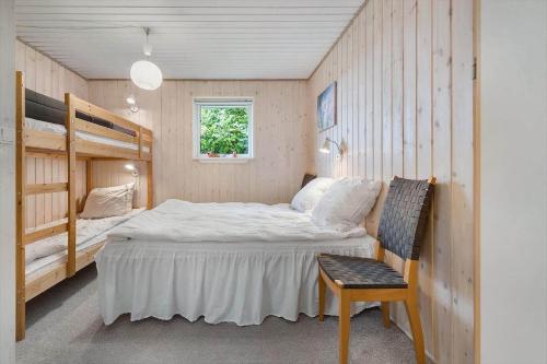 a bedroom with a bed and a bunk bed and a chair at FJ2401-Skibby-Gogevaenget-31 in Skibby