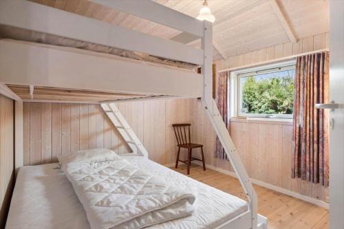 a bunk bed in a room with a window at FJ1600-Jaegerspris-Strandleddet-32 in Jægerspris