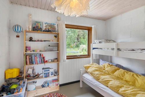 a small bedroom with a bed and a window at FJ2002-Skibby-Stormgardsvej-11 in Skibby