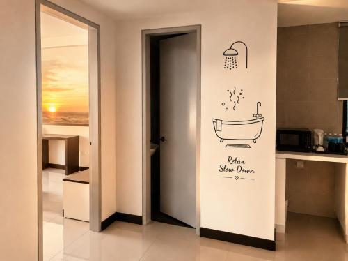 a bathroom with a bath tub sticker on the wall at D'Wharf Hotel & Serviced Residence in Port Dickson