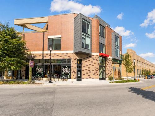 a building on the corner of a street at Upscale 3BR Penthouse by CozySuites in Indianapolis