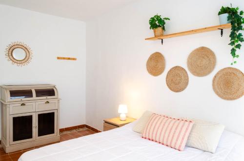 a bedroom with a bed and a stove at El Riu del Cel in Lloret de Mar