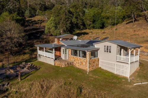 an aerial view of a house with a roof at Bellbird Rise Off-Grid Cottage in Conondale