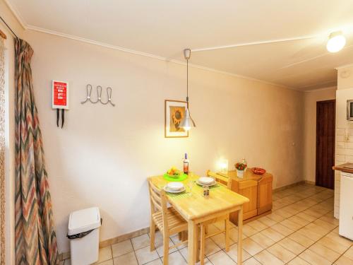 a kitchen and dining room with a table and chairs at Gorgeous Apartment in Bohon with Garden Furniture and BBQ in Barvaux