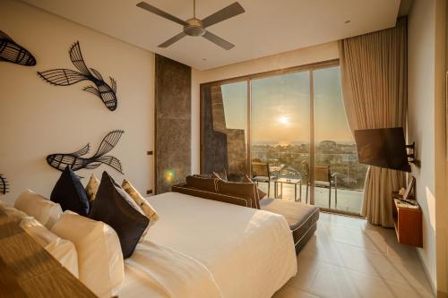 a bedroom with a large bed and a large window at Villa Omari Seaview Pool & Game Room Kata in Kata Beach