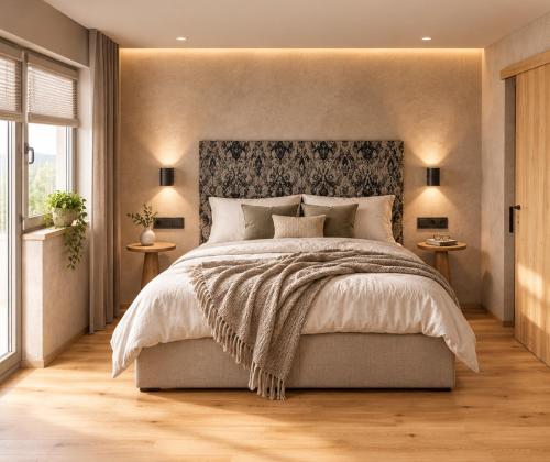 a bedroom with a large bed with a large headboard at Alpine Residence by alpenappartements in Mayrhofen