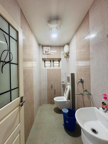 a bathroom with a sink and a toilet in it at Dream Nest Beach House in Alleppey