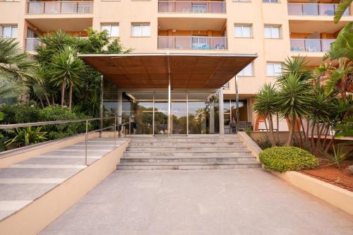a building with a staircase leading to a building at BLUESEA Salina Ex MD Atlantic in Es Cana