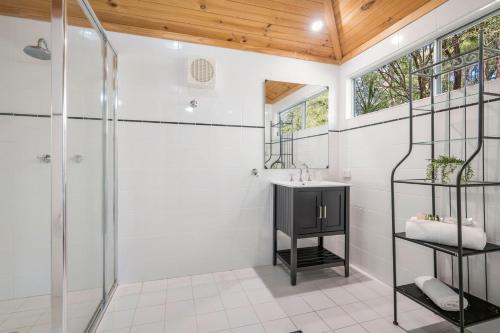 a bathroom with a shower and a sink at Historic Huntingdon House in Wauchope
