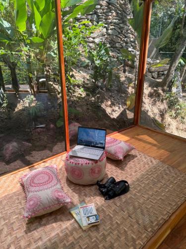 a laptop computer sitting on a table in a room at SeTena Tierra Humeda Ecolodge in Minca