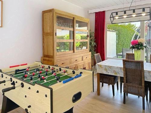 a room with a table and a large chess board at Holiday Home Ruiterlaan with parking by Interhome in Bredene