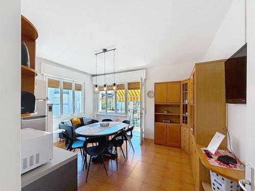 a kitchen and dining room with a table and chairs at Apartment Ca dei Noni by Interhome in Riva del Garda