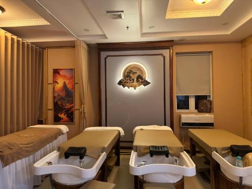 a hospital room with two beds and a mirror at Chu Long Hotel & Spa in Cat Ba
