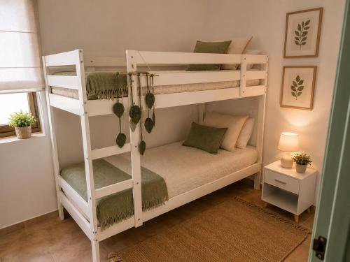 a couple of bunk beds in a room at El Refugio de Navalcuervo 