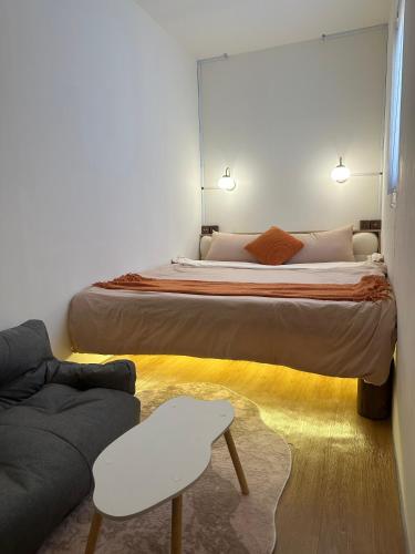 a bedroom with a large bed and a couch at 流浪秘境Wanderland in Green Island