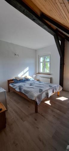 a large bedroom with a large bed in a attic at KAM-TECH Krzysztof Kamiński in Krzywy Róg
