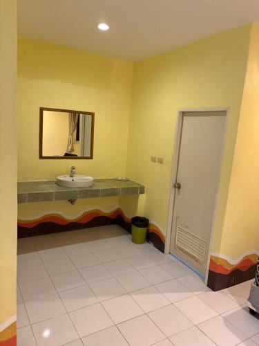 a bathroom with a sink and a mirror at Jano House in Ban Mae Nam