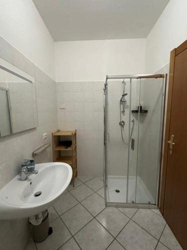 a bathroom with a shower and a sink at Appartamenti Ventuno in Riva del Garda