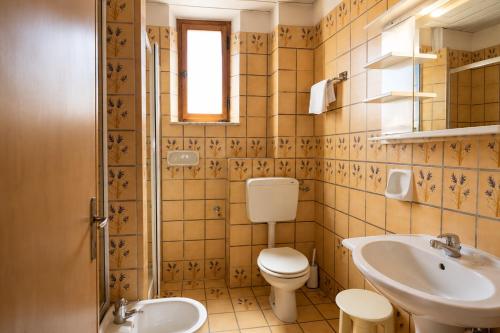 a bathroom with a toilet and a sink at Hotel Cristallo - Chianciano Terme in Chianciano Terme