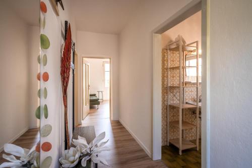 a hallway with a room with a staircase and a mirror at Villetta Allegra in Appiano sulla Strada del Vino