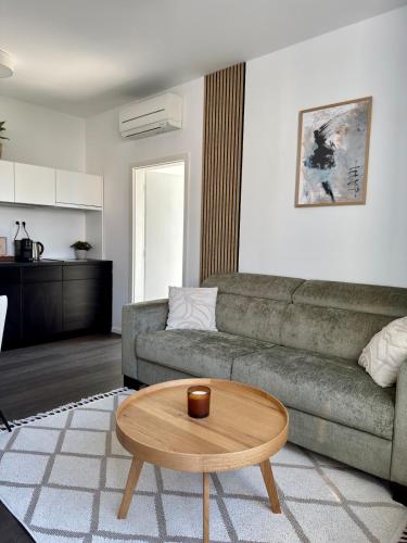 a living room with a couch and a coffee table at Cozy Apartment with Castle view in Staré Mesto