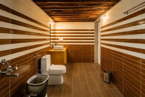 a bathroom with a toilet and a sink at Desert Luxury Camp & Resort Jaisalmer in Jaisalmer