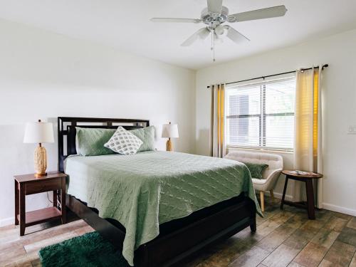 a bedroom with a bed and a ceiling fan at Studio in Pompano Beach two blocks from the Ocean in Pompano Beach