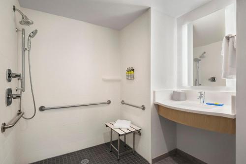 a bathroom with a sink and a shower at Holiday Inn Express Dumfries-Quantico by IHG in Dumfries