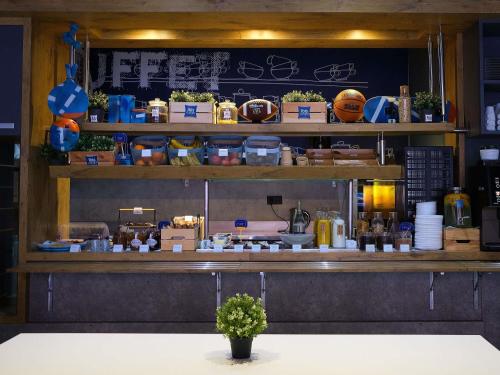 a counter in a restaurant with a counter sidx sidx at ibis budget Bilbao City in Bilbao