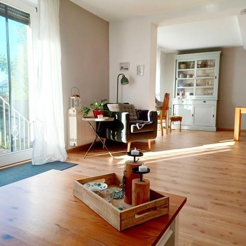 a living room with a couch and a table at Ferienwohnung Stadt-Land-Fluss in Bad Salzuflen