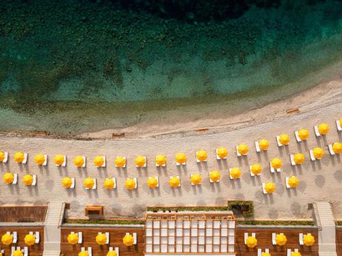 an overhead view of a stadium with yellow flowers at The Bodrum Hotel Yalıkavak - MGallery Collection in Yalıkavak