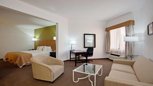 a hotel room with a bed and a desk at Holiday Inn Tijuana Zona Rio by IHG in Tijuana