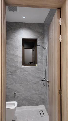 a bathroom with a shower with a toilet and a sink at O2P Al Salam in Medina