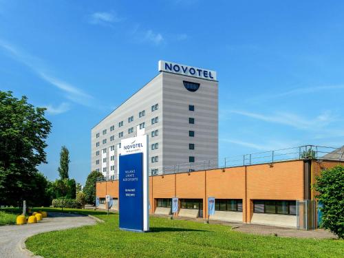 a novotel building with a sign in front of it at Novotel Milano Linate Aeroporto in Milan
